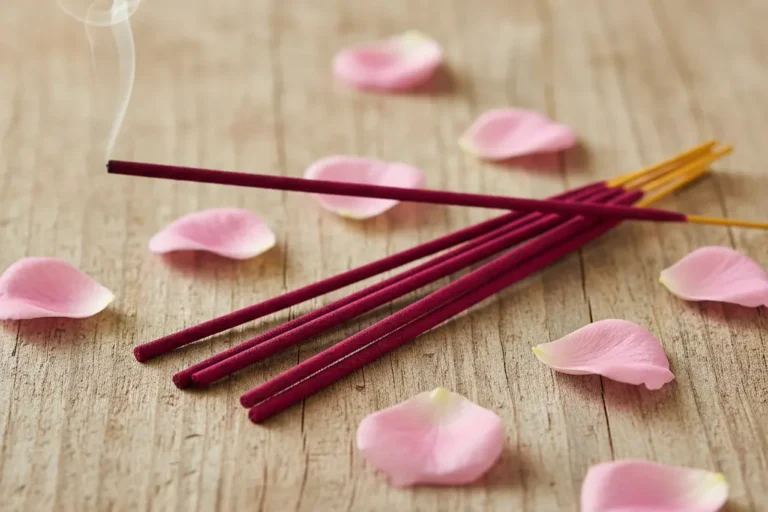Hand-rolled rose incense sticks with natural rose petals creating romantic floral ambiance
