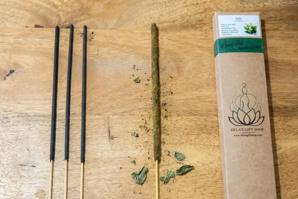 Comparison of chemical incense stick versus natural hand-rolled tulsi herbal incense stick texture