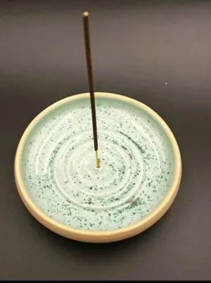 Handmade earth ware incense stick holder